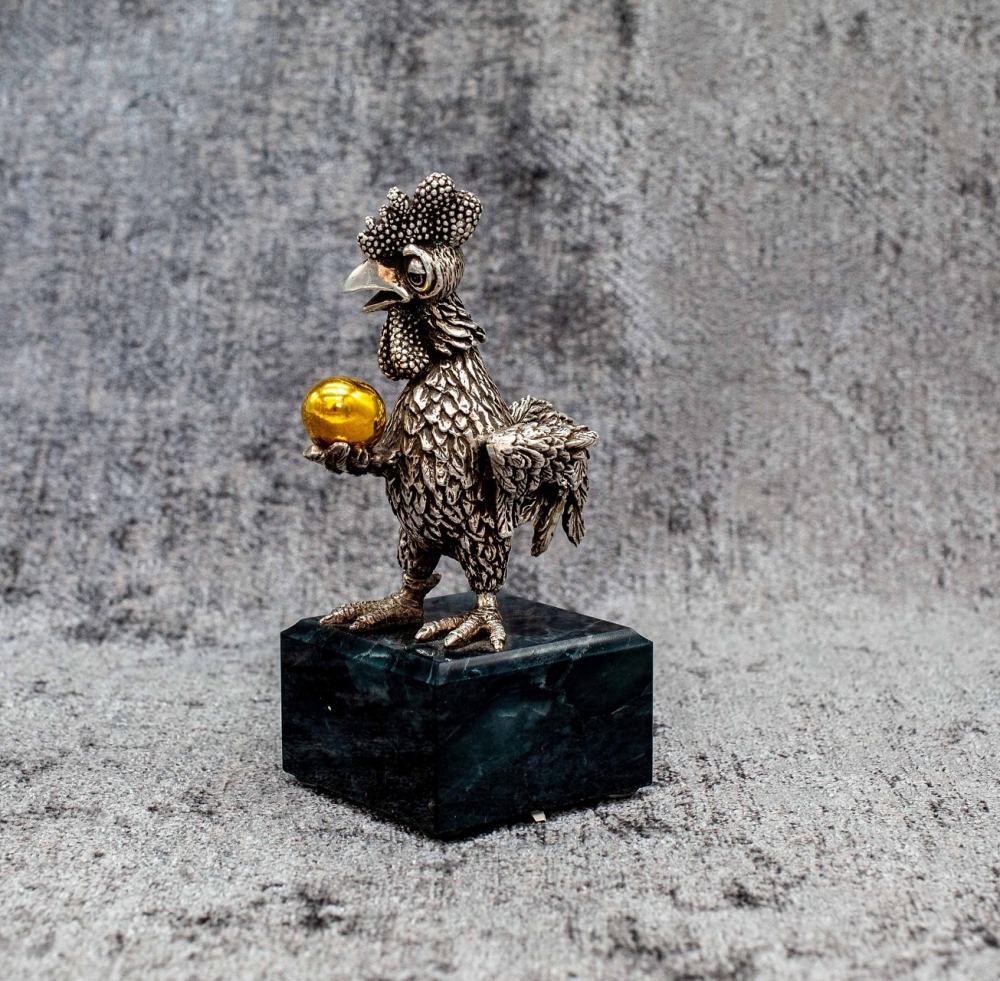 Silver figure Cock with a golden egg